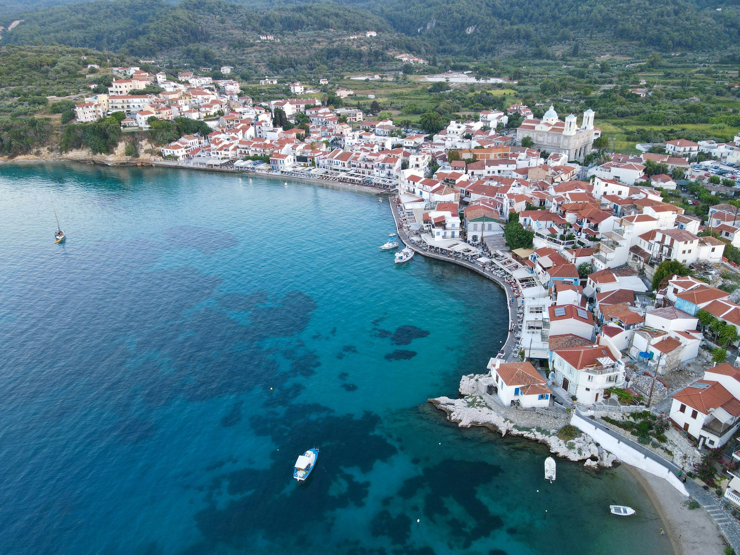 A whitewashed harbour village from the air